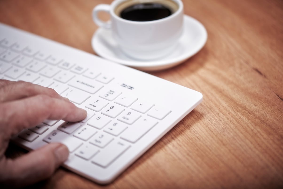 Human hand is typing on computer